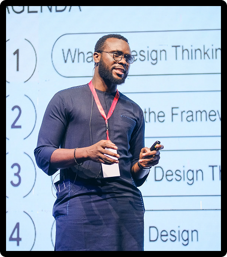 John Ohio speaking at DevFest Lagos 2024 on 'Design Thinking for Problem-Solving: Beyond UX Design'